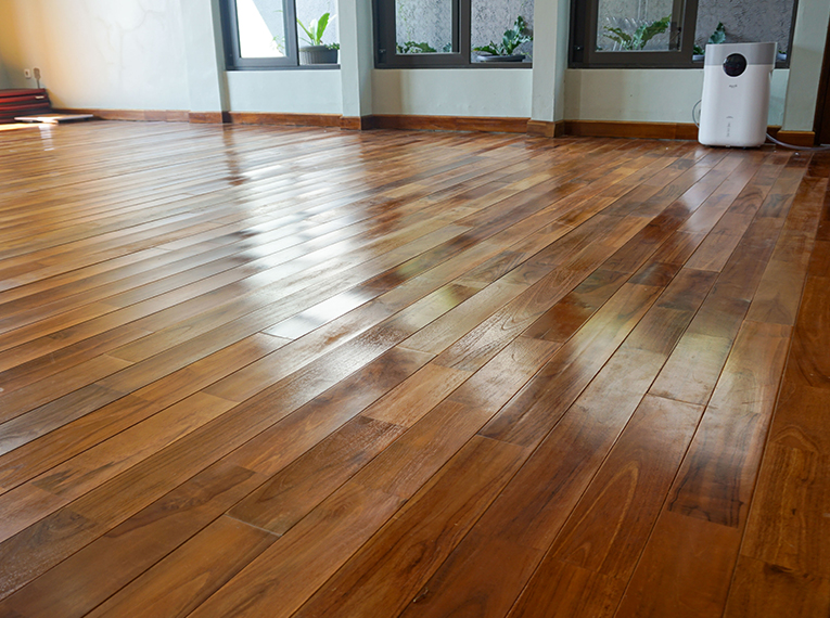 Repairing Winter Damage: When to Refinish vs. Replace Your Hardwood Floors